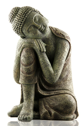 Buddhist statue in a relaxed position, meditating