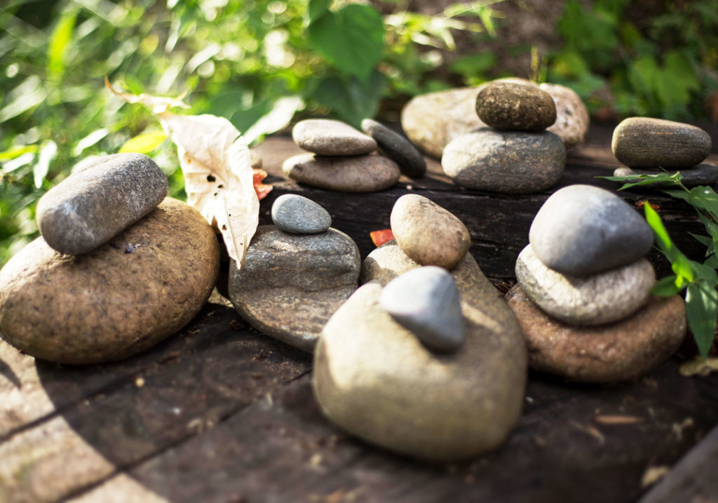multiple stone cairns, representing a work life balance