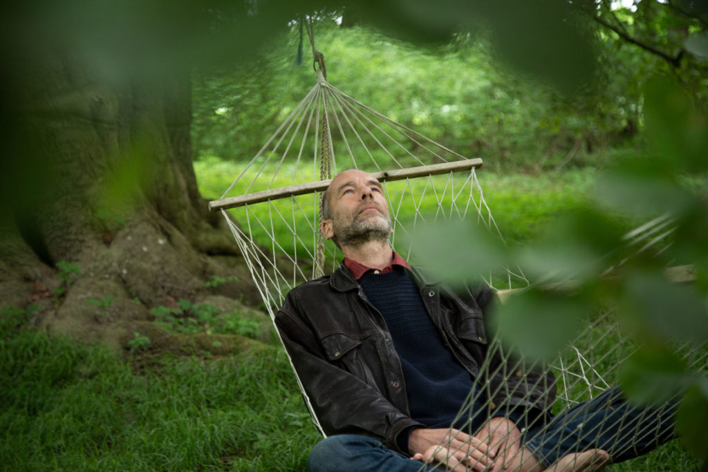 Stephan, who has training in radiant mind, is resting in a hammock