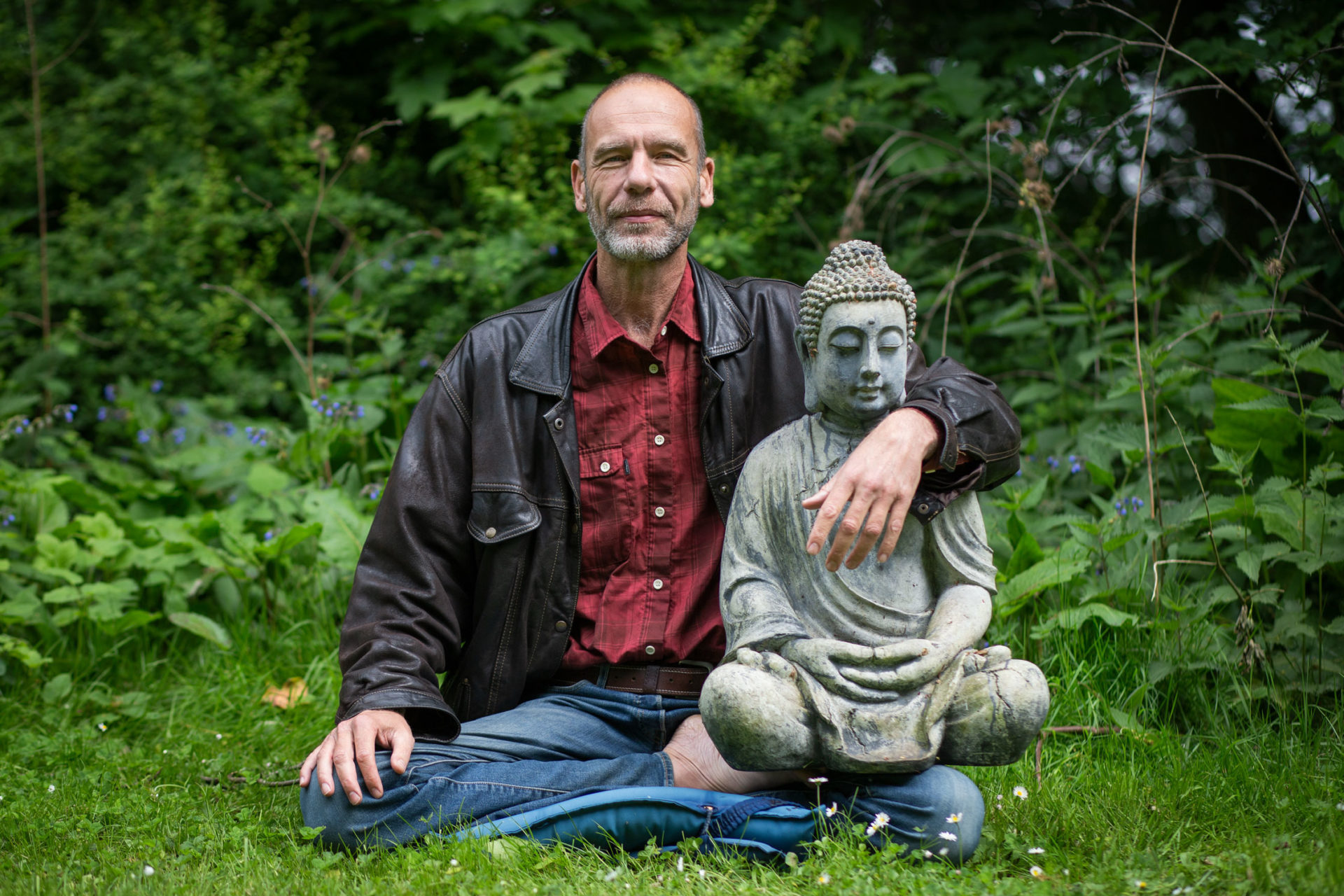 Spiritual Mentor Stephan Pende with Buddhist Statue
